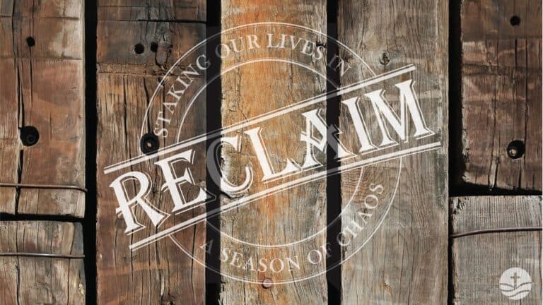 Wooden church door with "Reclaim" message and seasonal theme at New Albany United Methodist Church.